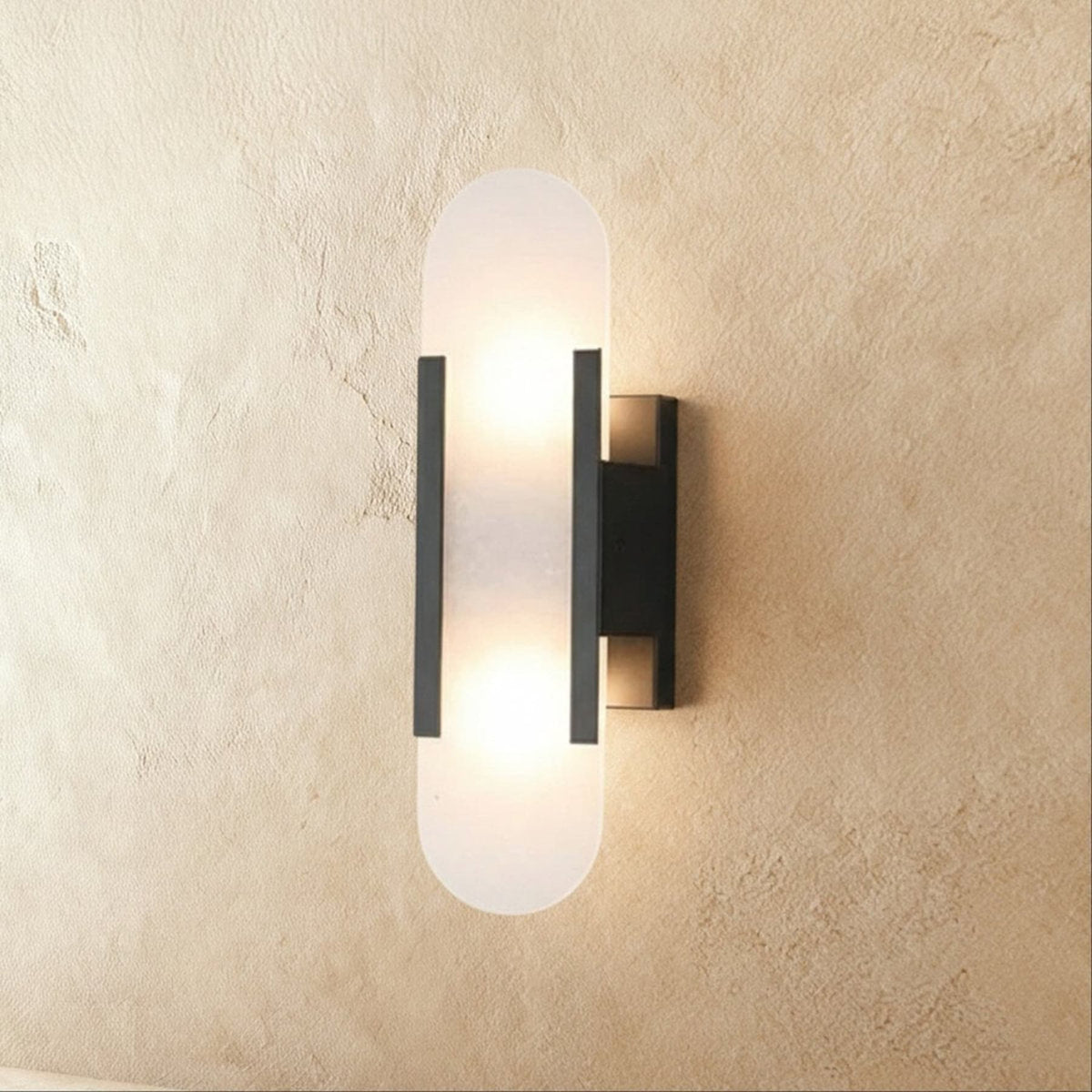 Modern Brass Wall Light With Warm LED Glow in Black — James New York